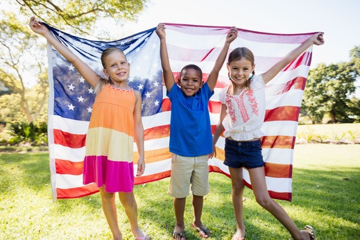pikwizard--happy-children-showing-usa-flag.jpg